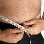 overweight-man-measuring-waist-752485